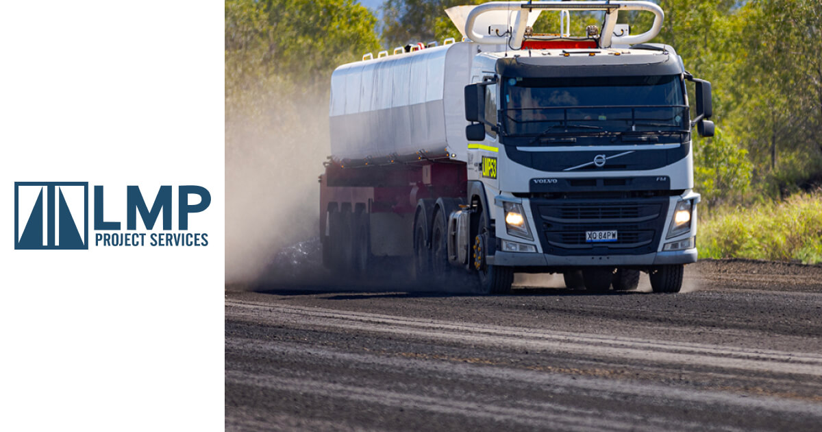 LMP Project Services water truck performing road maintenance, ensuring dust control on-site.